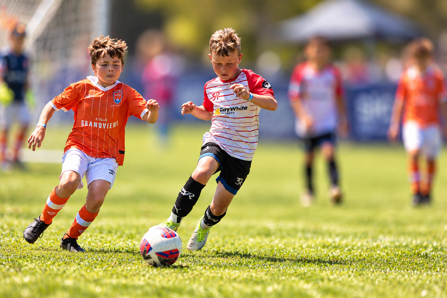 Players challenging for the ball in bright sunlight
